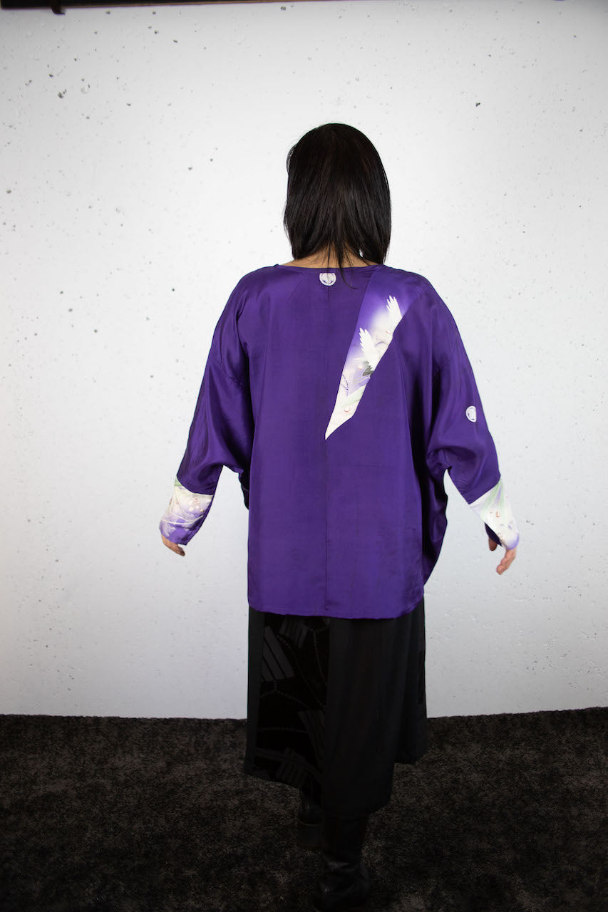 Long-sleeved shirt with purple auspicious crane design made from old clothes.
