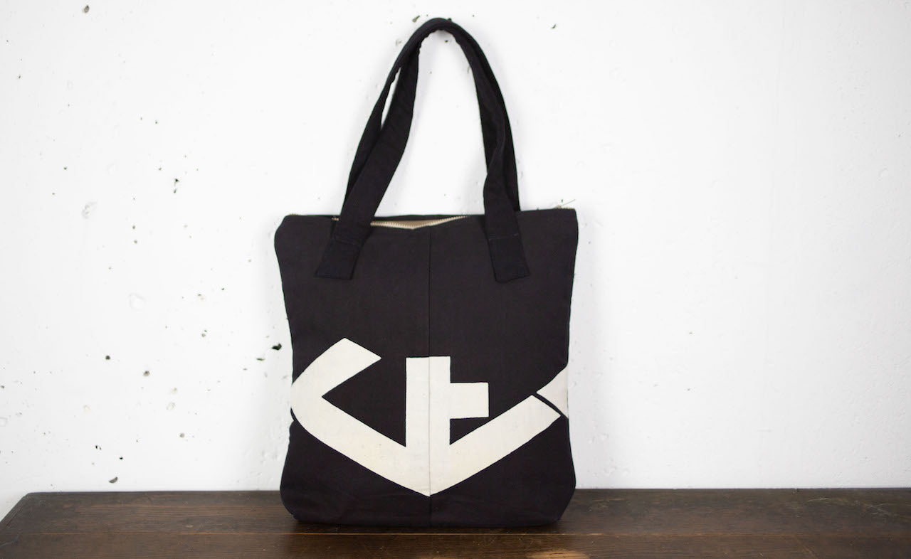 Indigo-dyed hand-stitched handbags made of old fabric with family crests