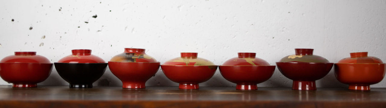 Elegant black lacquer ware bowl with plum design