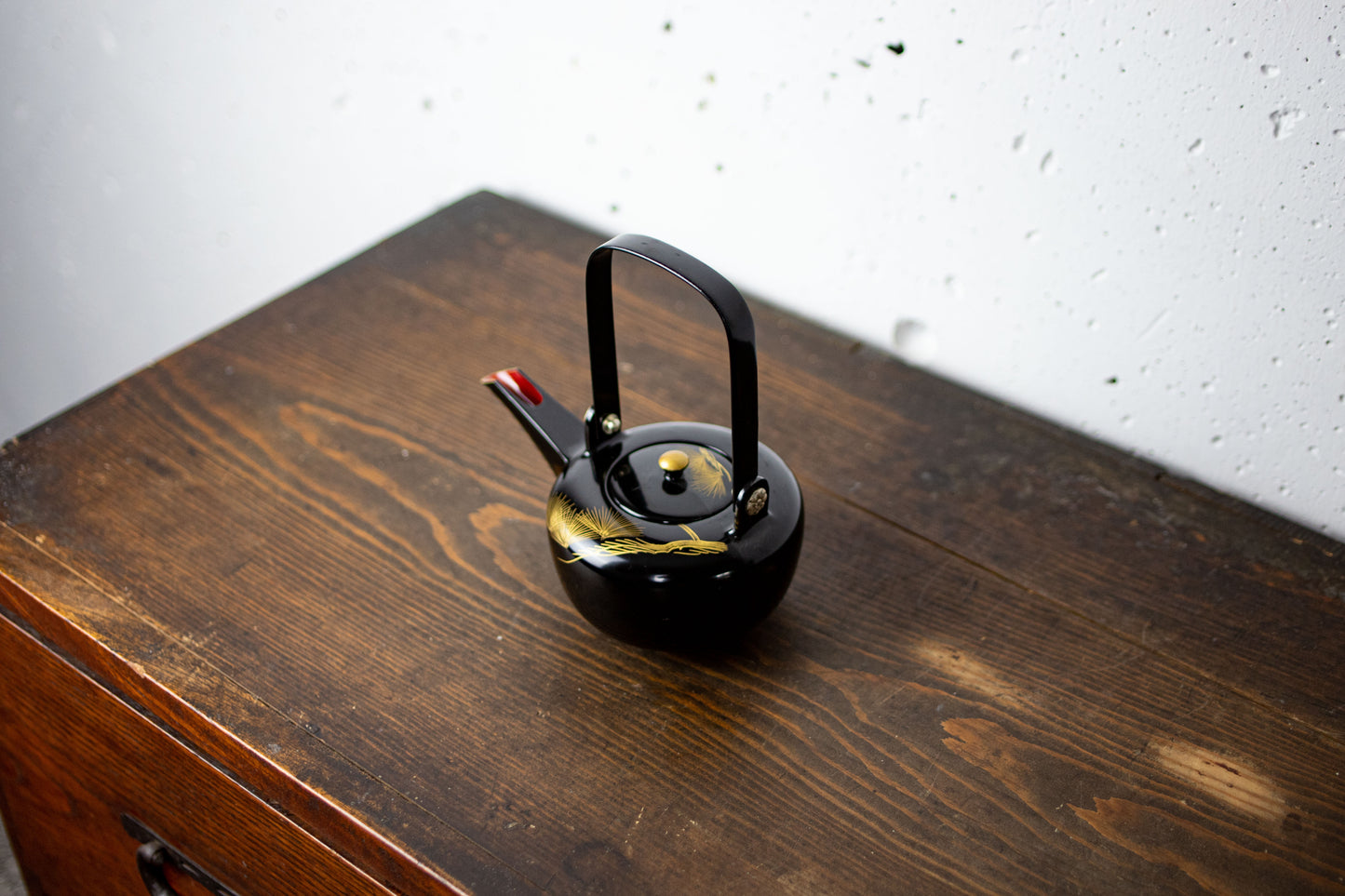 Lacquered sake bottle chokes for holding alcohol at weddings
