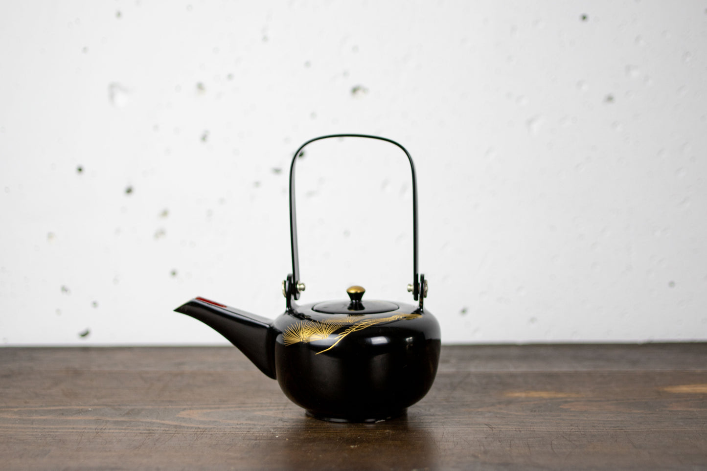 Lacquered sake bottle chokes for holding alcohol at weddings