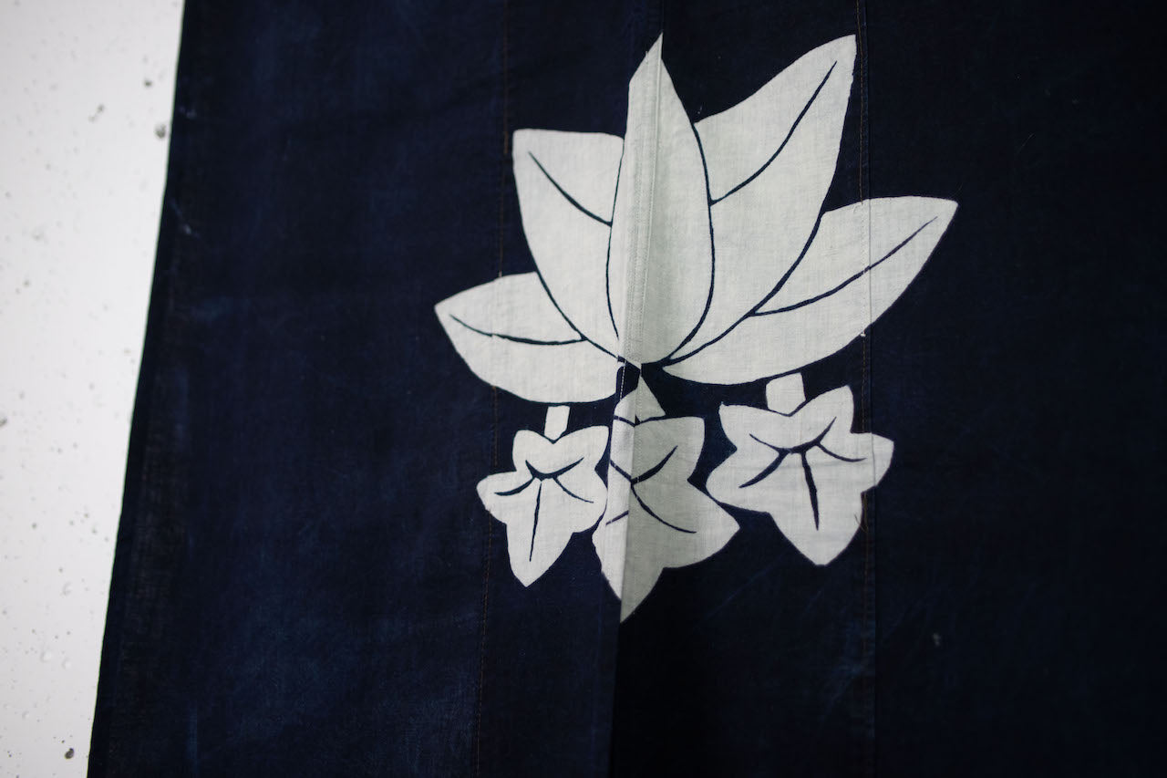 Handmade goodwill made of old indigo-dyed family crested flags and cover cloth.