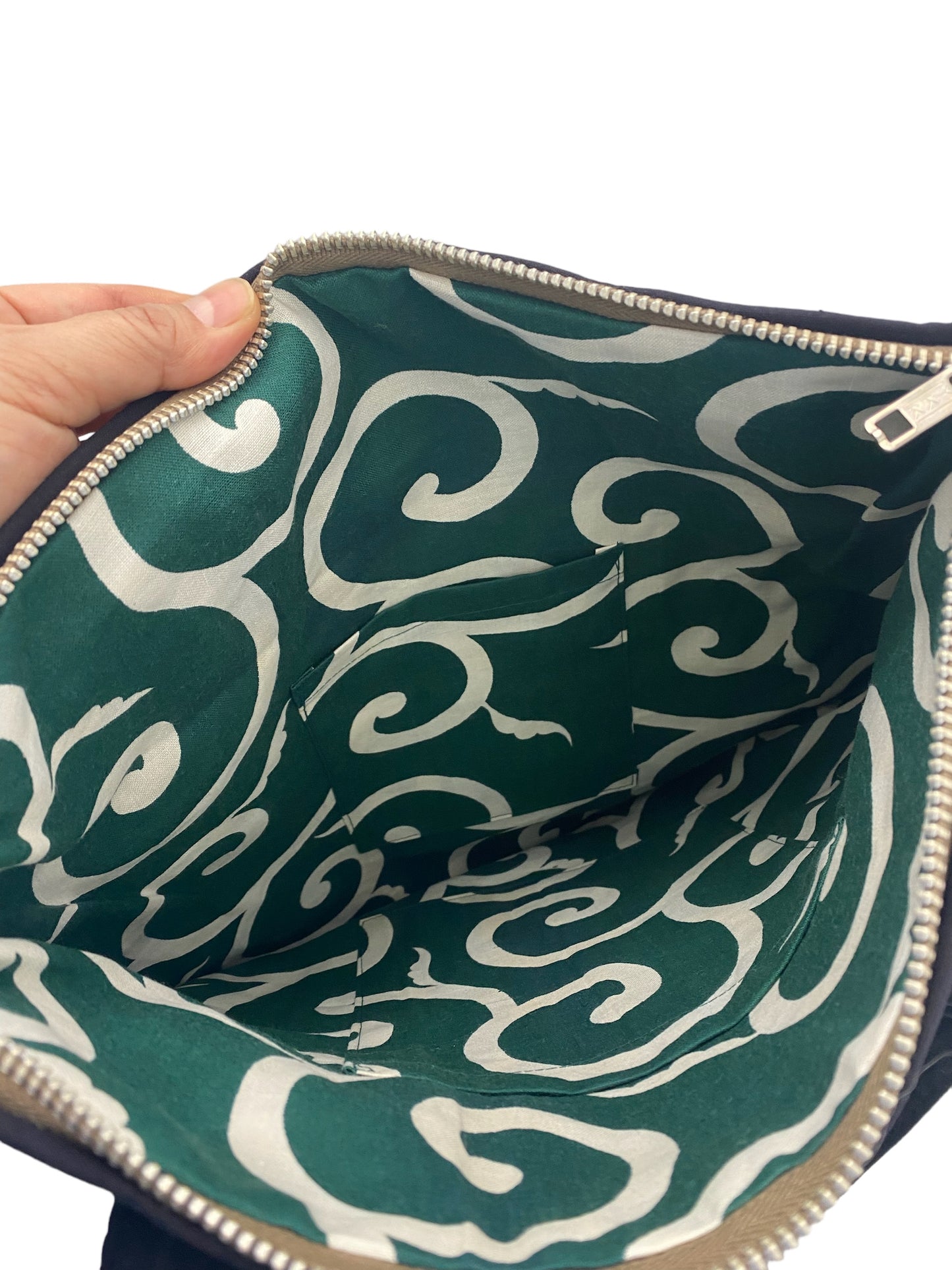 Indigo-dyed hand-stitched handbags made of old fabric with family crests