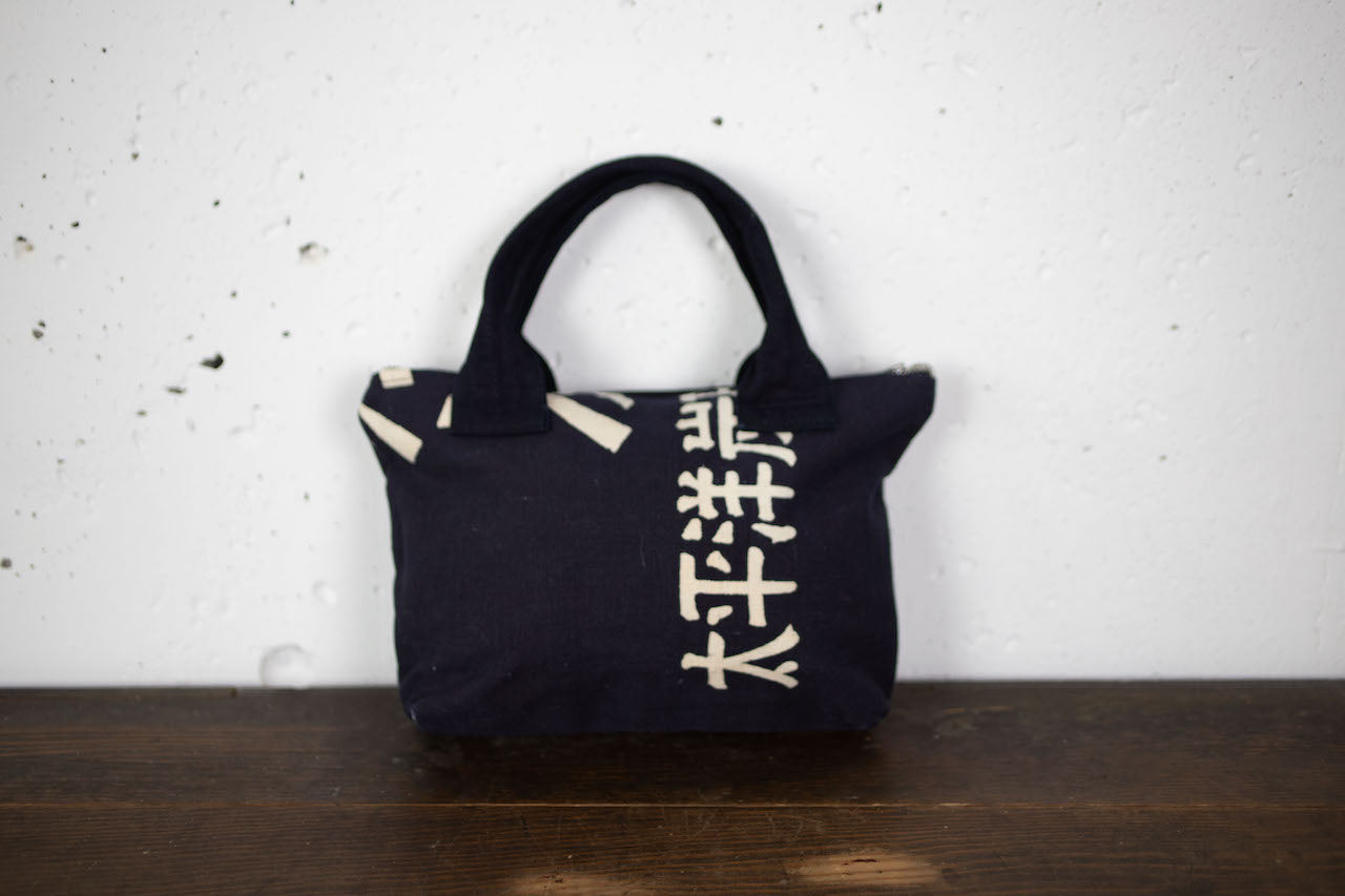 Indigo-dyed hand-stitched handbags made from old fabric