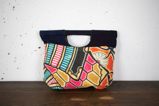 Handbags made of MUSHANOBORI fabric with unique hand-stitched shapes.