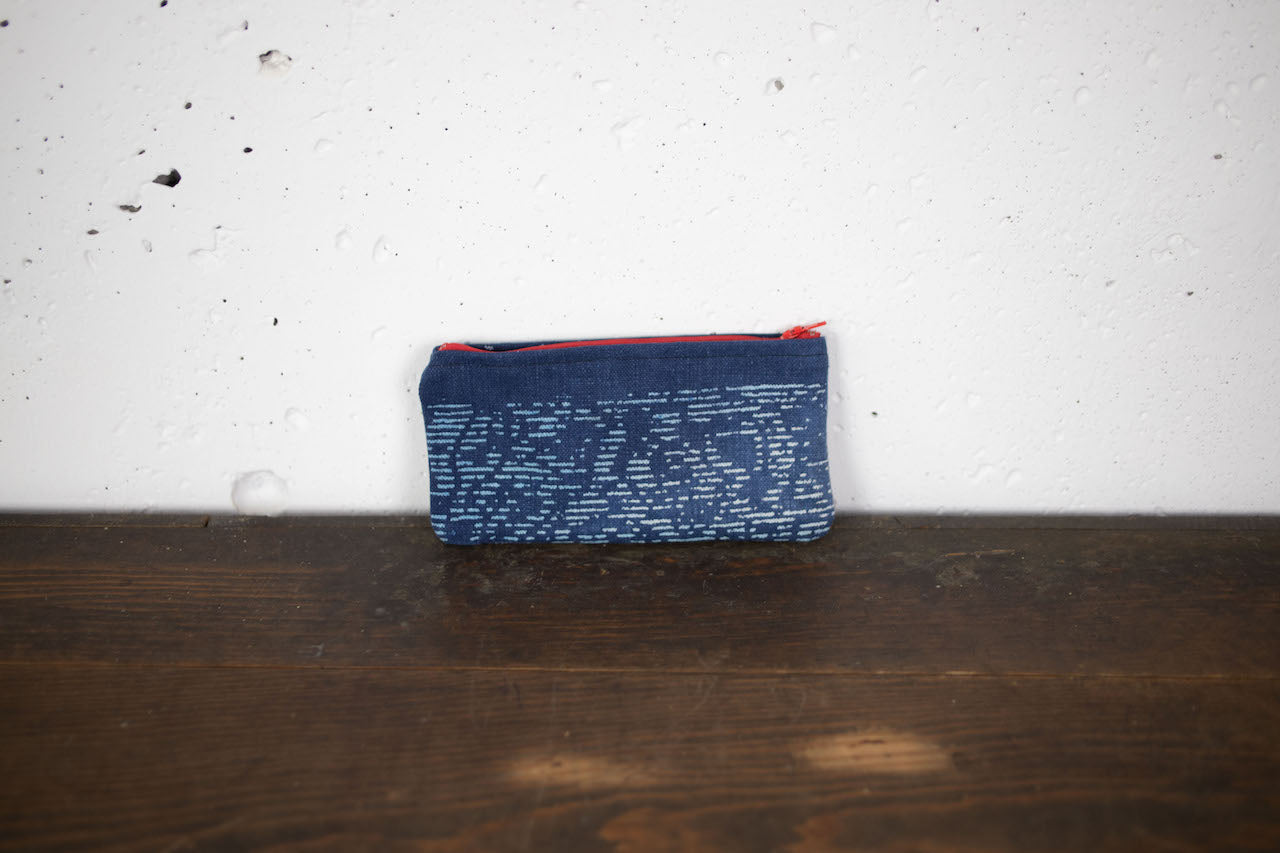 Hand-stitched pouches ideal for glasses or ballpoint pens.