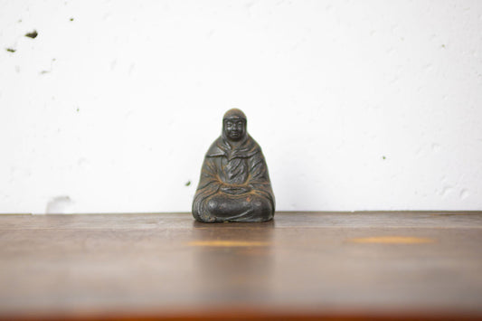 Monk figurine made of iron.