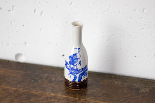 Small sake bottle with crane pattern.
