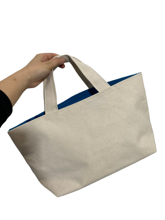 Pure white tote bag with celebratory flags on the inner fabric.